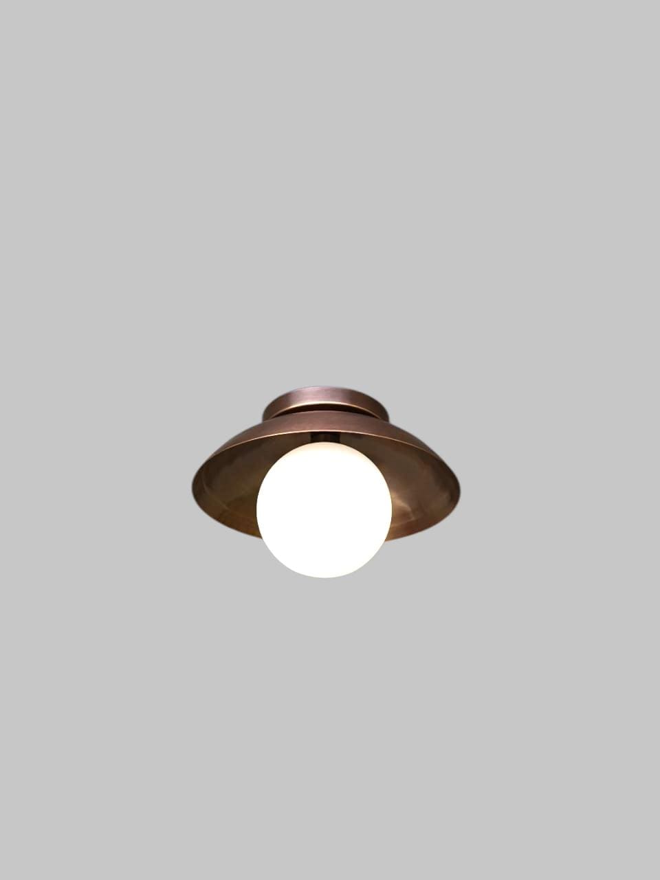 Handcrafted Single Light Raw Brass Italian Flush mount ceiling light fixture with frosted Glass Globe