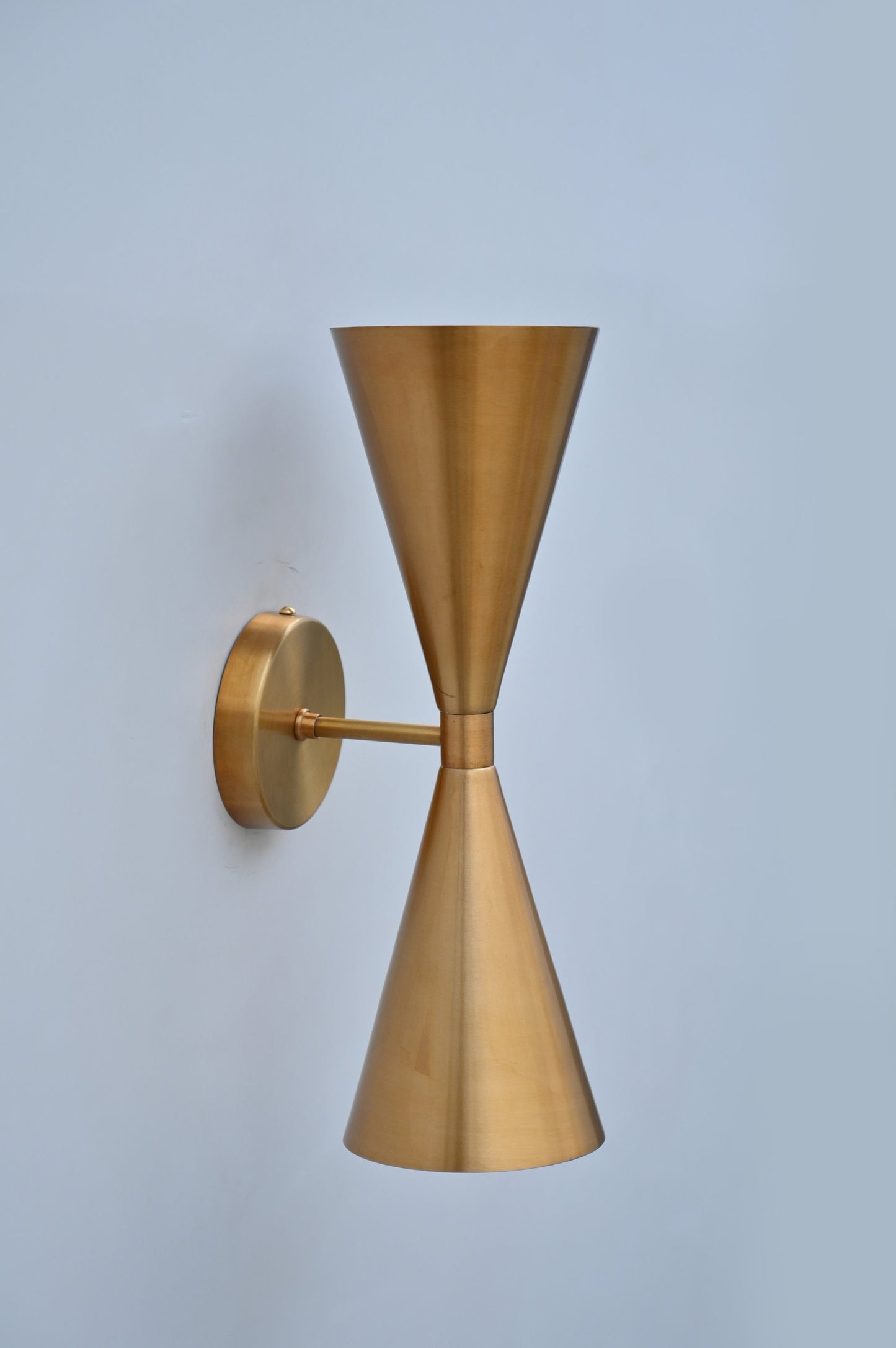 Mid-Century Modern Brass Wall Sconce with Upward and Downward Illumination, Handcrafted Light Ideal for Enhancing Any Interior Space