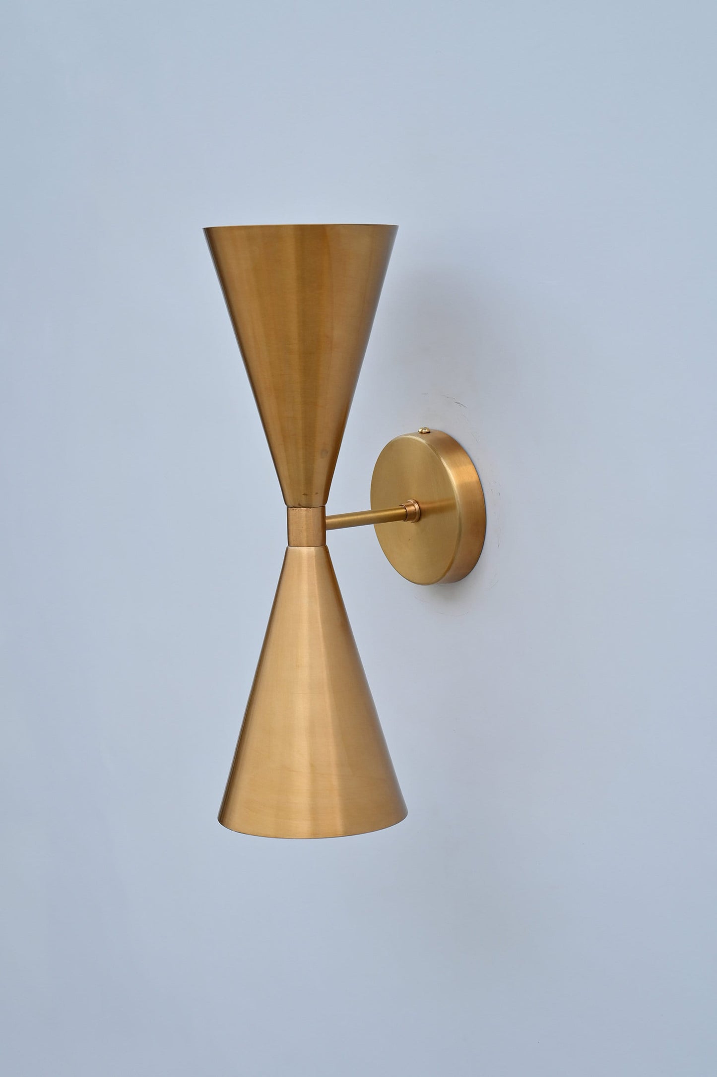 Mid-Century Modern Brass Wall Sconce with Upward and Downward Illumination, Handcrafted Light Ideal for Enhancing Any Interior Space